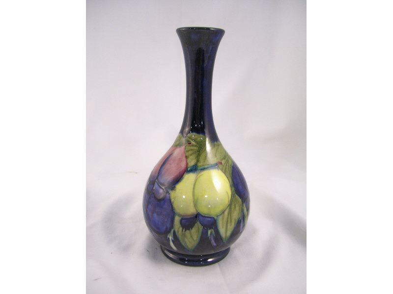 Appraisal: Moorcroft Plums Vase Bottle neck form vase with a cobalt