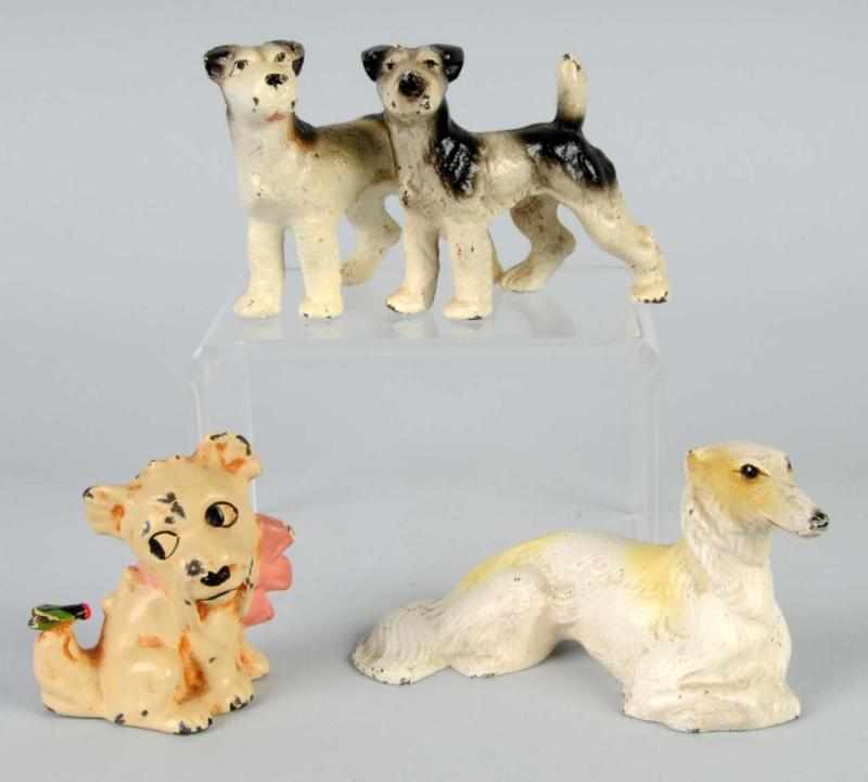 Appraisal: Lot of Cast Iron Dog Paperweights Description Assorted Hubley dogs