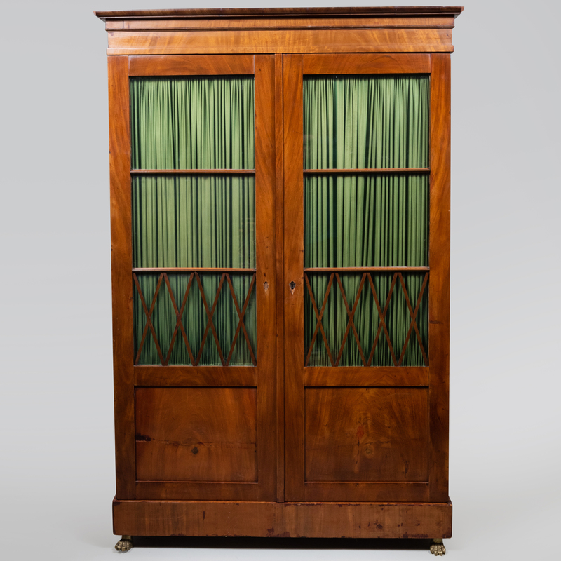 Appraisal: Biedermeier Glazed Mahogany Bookcase Fitted with four shelves and fabric