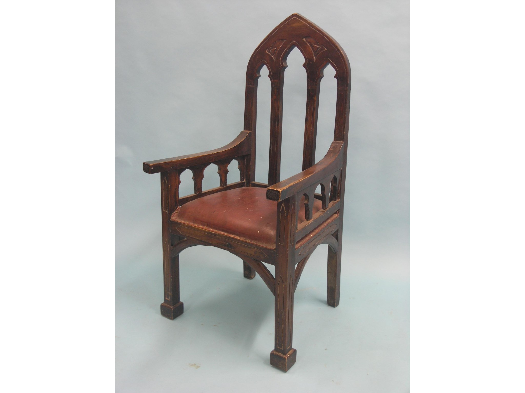 Appraisal: A gothic-style dark beech armchair with upholstered seat