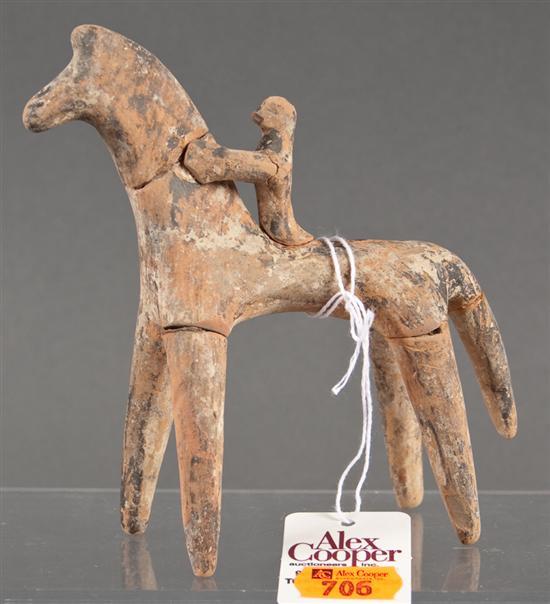 Appraisal: Primitive painted earthenware figure of a horse and rider identified