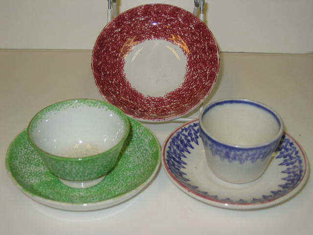 Appraisal: ENGLISH SPATTERWARE Five pieces green spatter handless cup and saucer