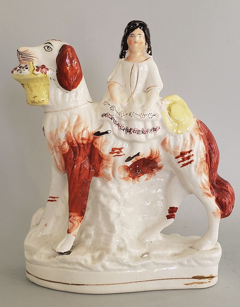 Appraisal: th Century Staffordshire Figure of a Woman Riding a Dog