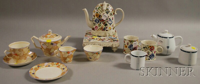 Appraisal: Three Partial Ceramic Tea Sets four-piece tea set with quilted