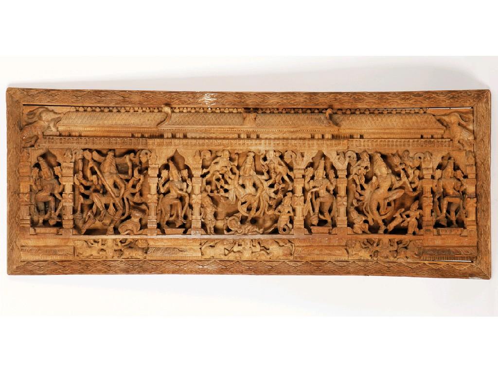 Appraisal: AN INDIAN CARVED WOOD PANEL depicting deity figures in a