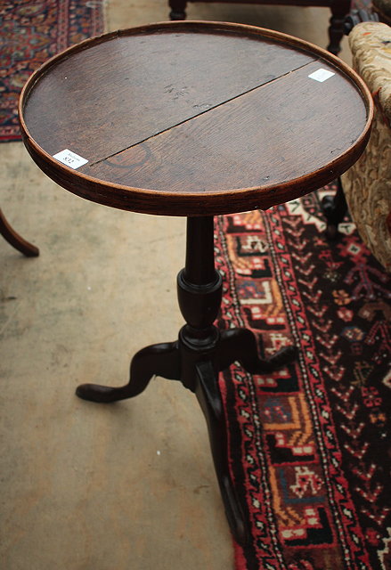 Appraisal: A VICTORIAN WALNUT STOOL with circular overstuffed upholstered seat and