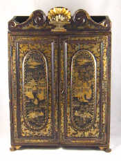 Appraisal: A Chinese lacquered cabinet on claw feet the black surface