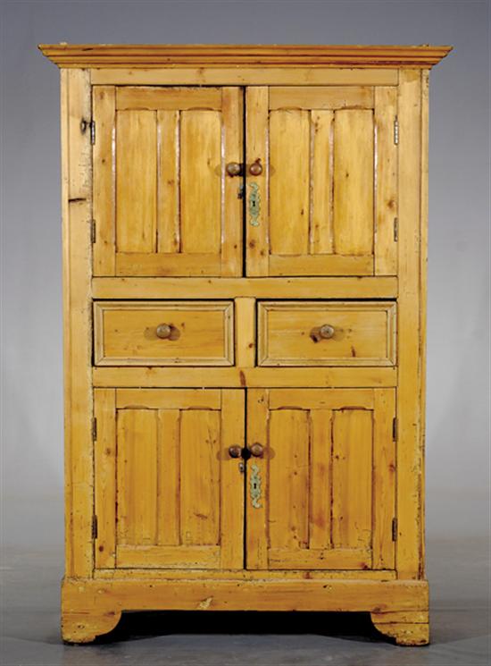 Appraisal: Irish pine press cupboard th century molded cornice above pair