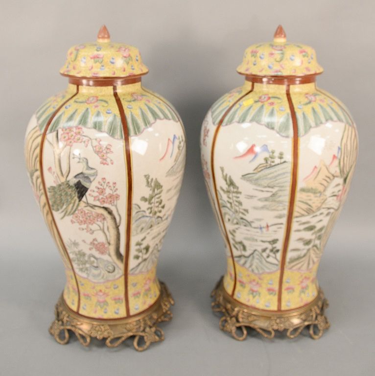 Appraisal: Pair of large Chinese style porcelain urns on metal bases