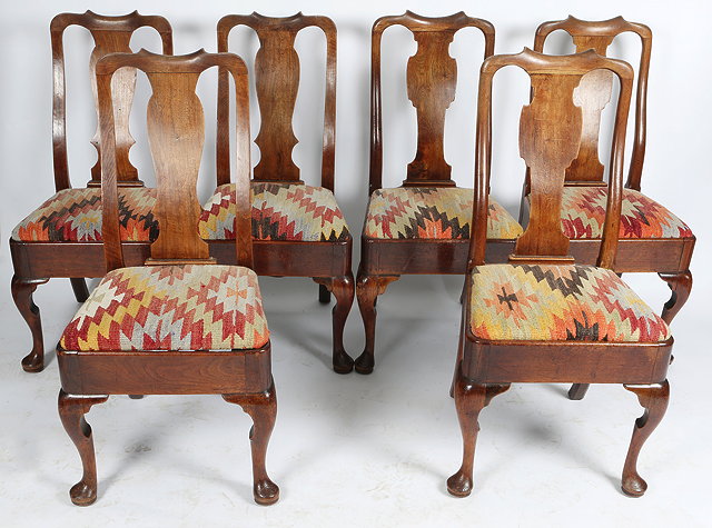 Appraisal: A MATCHED SET OF SIX GEORGE II WALNUT DINING CHAIRS