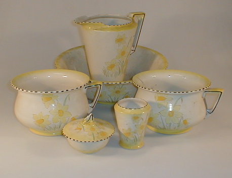 Appraisal: A Burleigh ware pottery toilet set painted with daffodils between