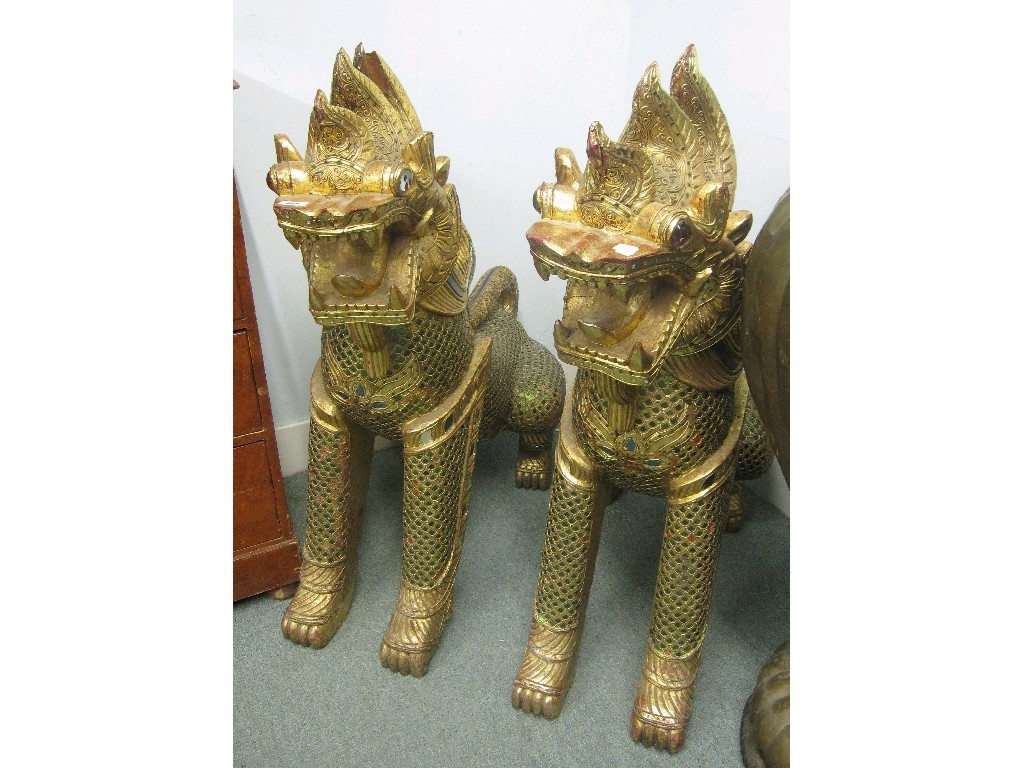 Appraisal: Pair of giltwood temple dogs