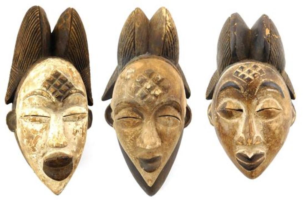 Appraisal: TRIBAL Three Punu style masks th C carved wood with