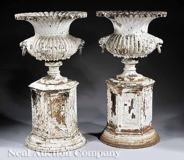 Appraisal: A Pair of American Cast Iron Garden Urns on Pedestals