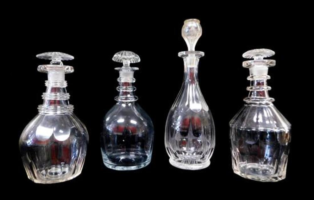 Appraisal: GLASS Four th early th C clear glass decanters blown