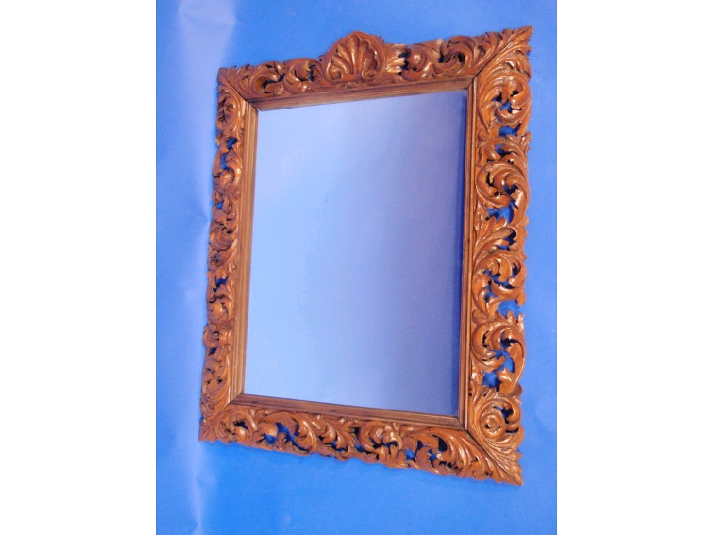 Appraisal: An Italianate carved walnut wall mirror the rectangular frame carved