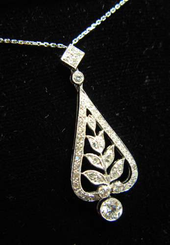 Appraisal: DIAMOND AND EIGHTEEN KARAT WHITE GOLD PENDANT NECKLACE set with