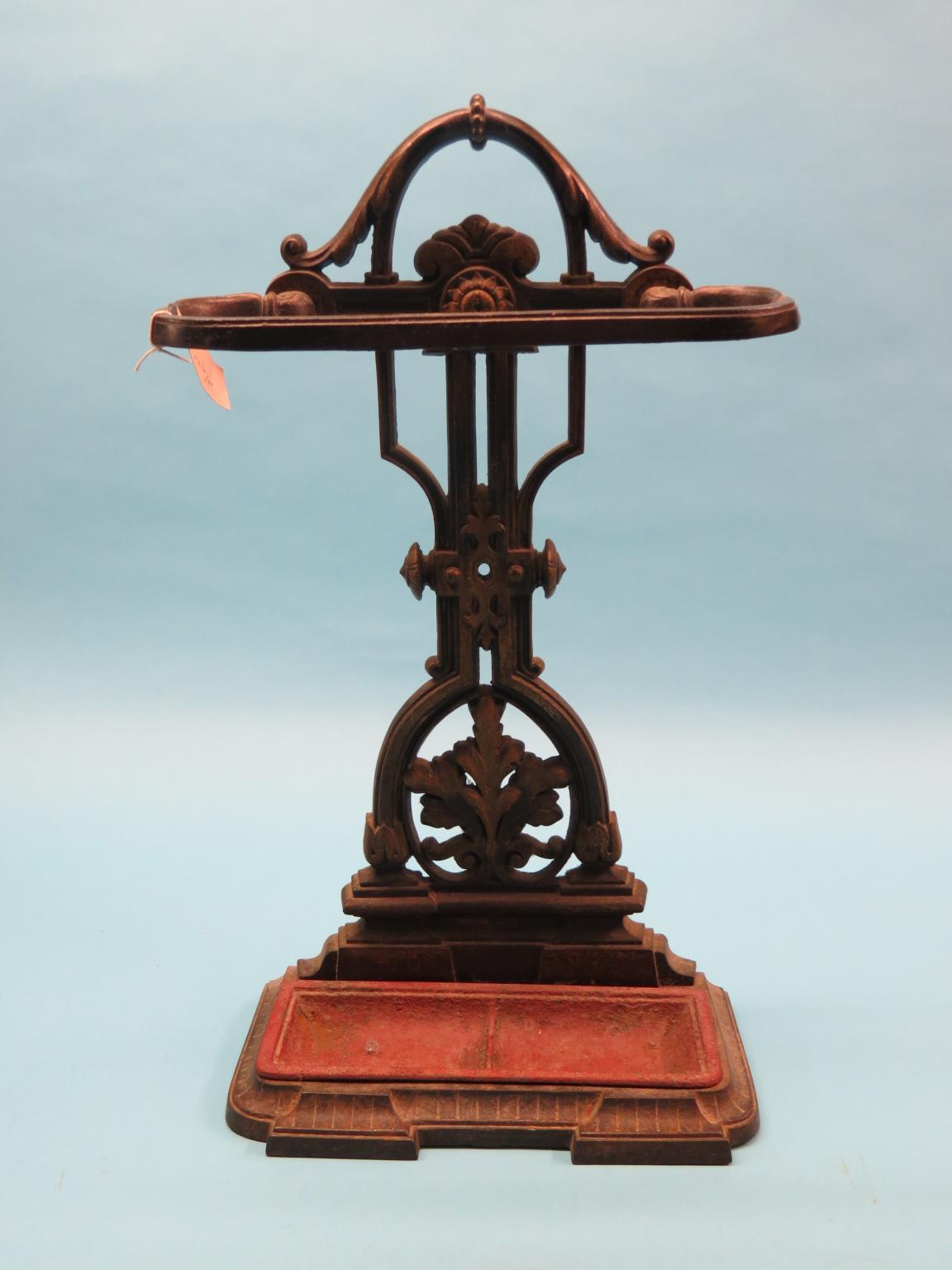 Appraisal: A Victorian cast iron stick-stand with parcel-gilt detail and drip-tray