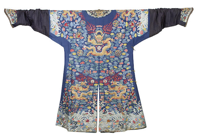 Appraisal: A Chinese embroidered dragon robe or chi-fu Of blue silk