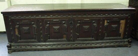 Appraisal: A late th Century oak coffer plank top quadruple panel