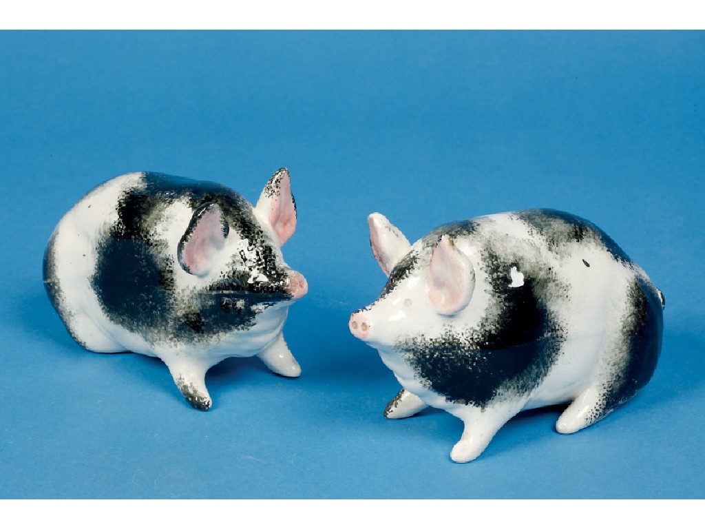 Appraisal: A PAIR OF WEMYSS POTTERY MODELS OF PIGS each with