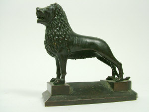 Appraisal: A bronze Babylonian style lion on a shaped stepped plinth