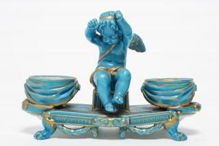 Appraisal: Sevres-style turquoise-glazed porcelain inkwell with putto cherub figure H X