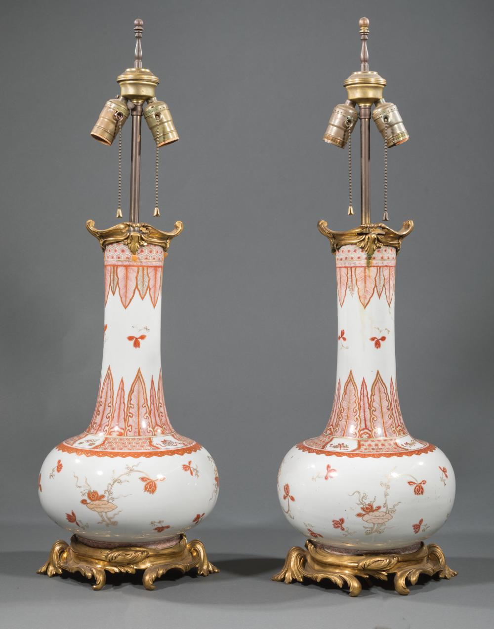 Appraisal: Pair of Chinese Iron Red and Gilt Decorated Porcelain Bottle