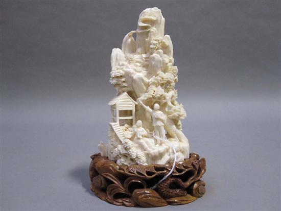 Appraisal: CHINESE CARVED IVORY PROPOGANDA GROUP th C depicting a mountain