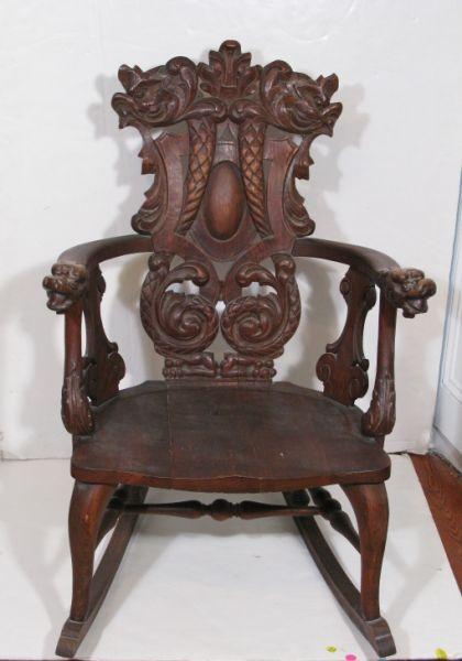 Appraisal: Carved Oak Rocking Chair early th c exotic relief carved