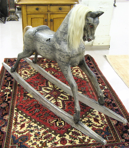 Appraisal: LARGE AMERICANA STYLE ROCKING HORSE the standing wood steed with