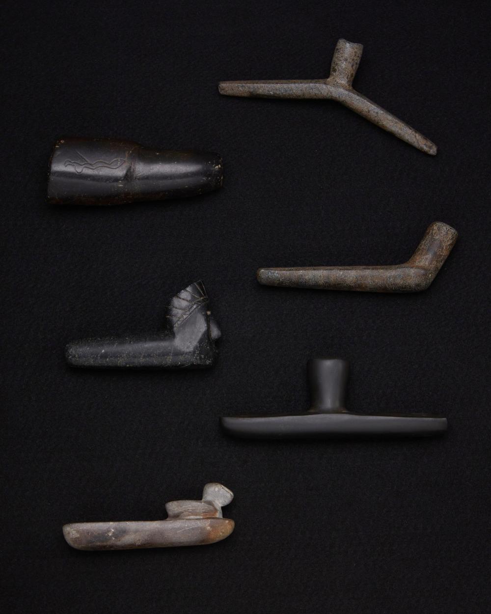 Appraisal: A group of carved stone pipes Pre-historic or later Comprising