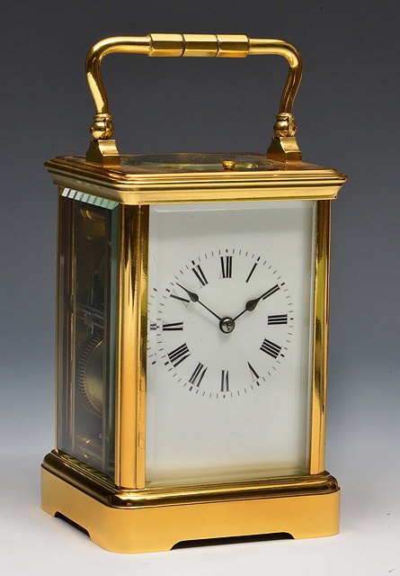 Appraisal: A French carriage clockwith white enamel Roman dial platform lever