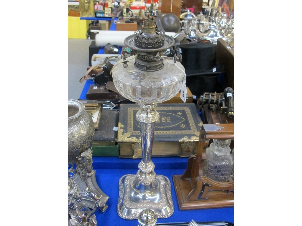 Appraisal: A silver plate and moulded glass oil lamp