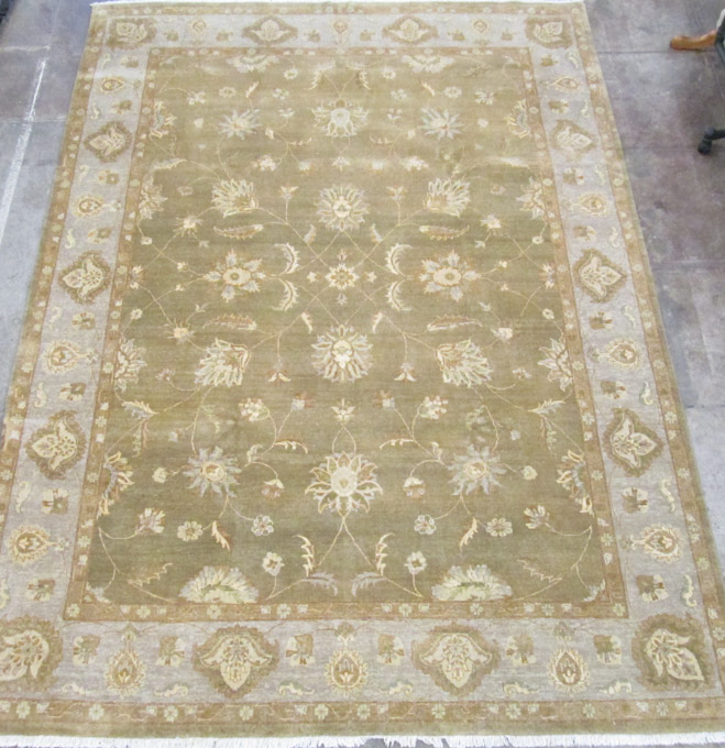 Appraisal: HAND KNOTTED ORIENTAL CARPET Pakistani-Persian scrolling floral raceme design on