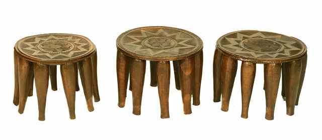 Appraisal: A SET OF THREE NIGERIAN NUPE TAPA CIRCULAR WOODEN STOOLS