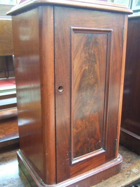 Appraisal: A th century mahogany pot cupboard with moulded top and