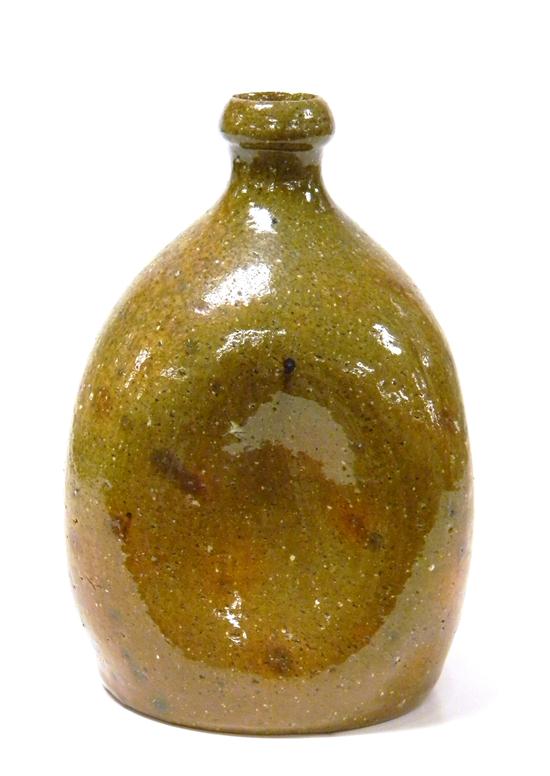 Appraisal: th C glazed pottery bottle with pinched sides and shaped