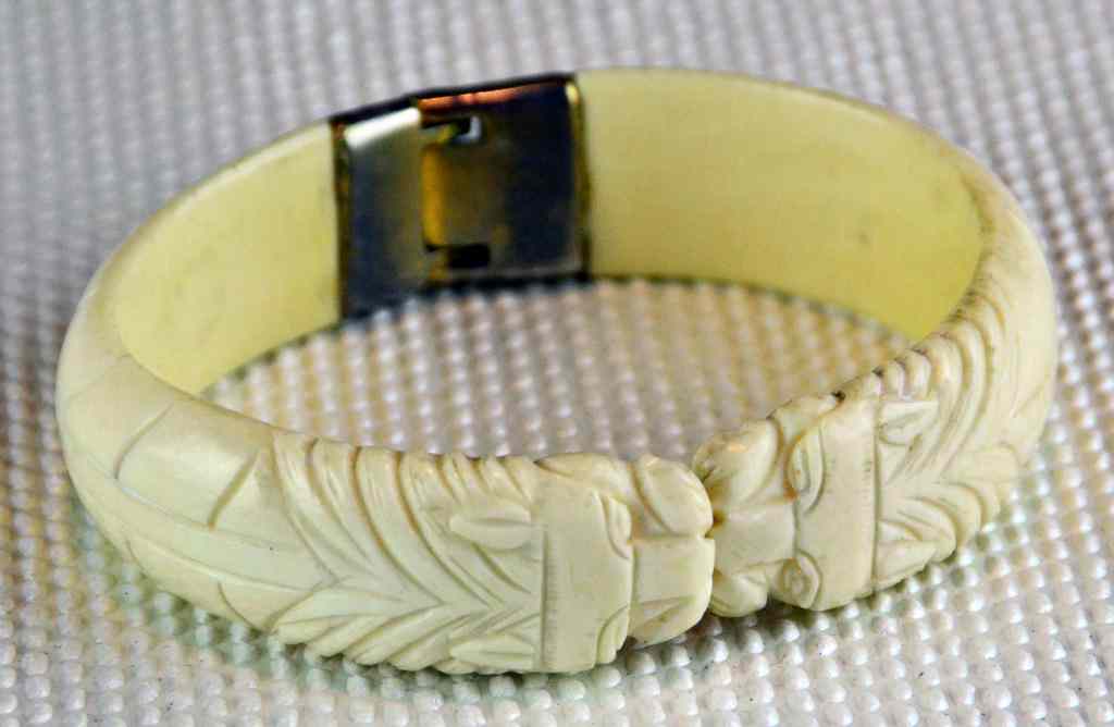 Appraisal: Chinese Carved Ivory Bangle BraceletCarved to depict two serpents with