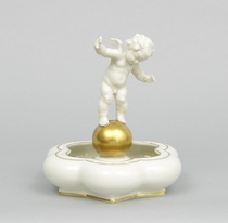 Appraisal: A Hutschenreuter Figurine With a Bowl A fine porcelain figurine