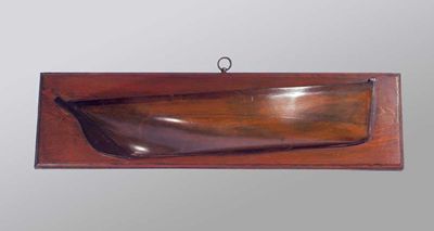 Appraisal: A stained wooden model of a half hull mounted on