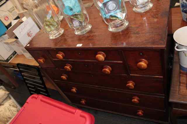 Appraisal: A VICTORIAN MAHOGANY CHEST of seven drawers with turned handles