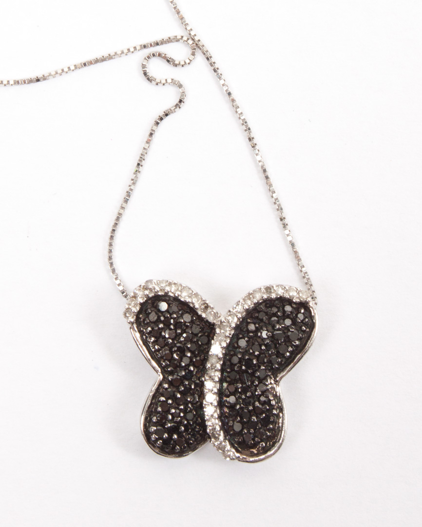 Appraisal: K white gold black white diamond pendant pendant in the