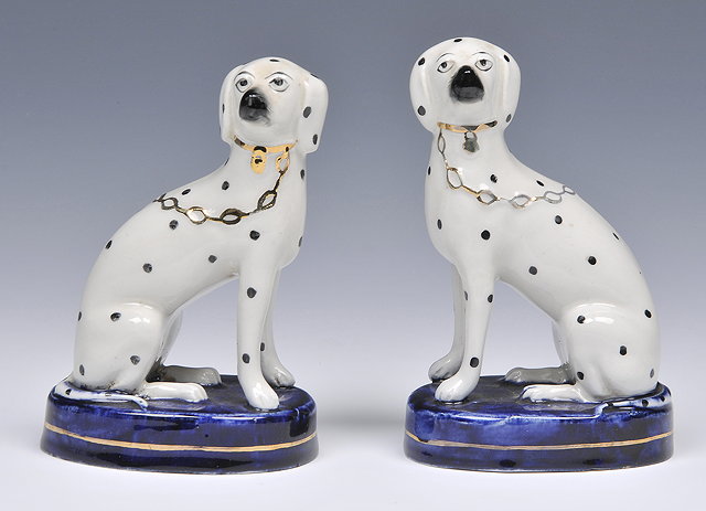 Appraisal: A PAIR OF STAFFORDSHIRE POTTERY MODELS OF DALMATIANS cm high