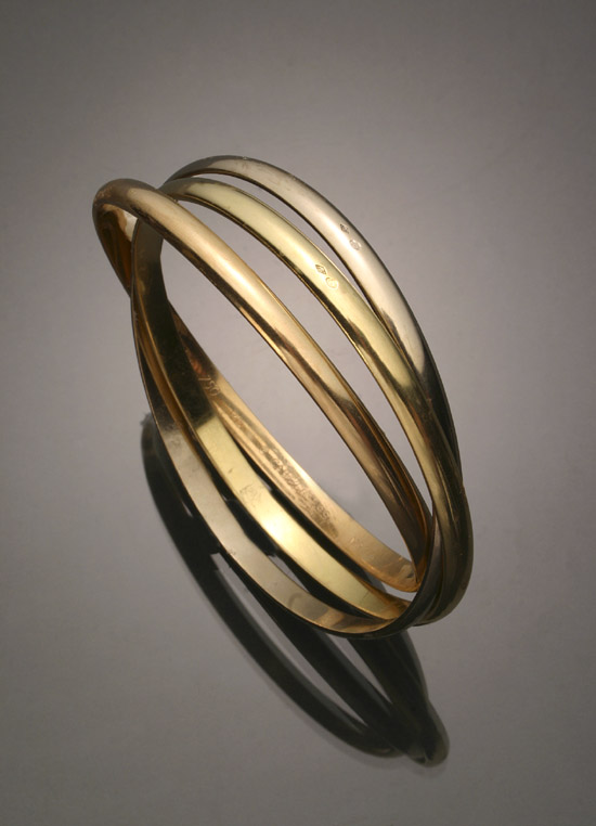 Appraisal: -Karat Tricolored-Gold 'Trinity' Bangle Bracelet Cartier Together with the original