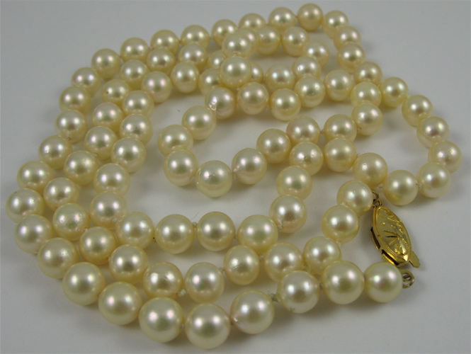 Appraisal: PEARL AND SILVER NECKLACE in length and strung with round