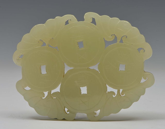 Appraisal: A CHINESE MUTTON FAT JADE PLAQUE carved as four Chinese