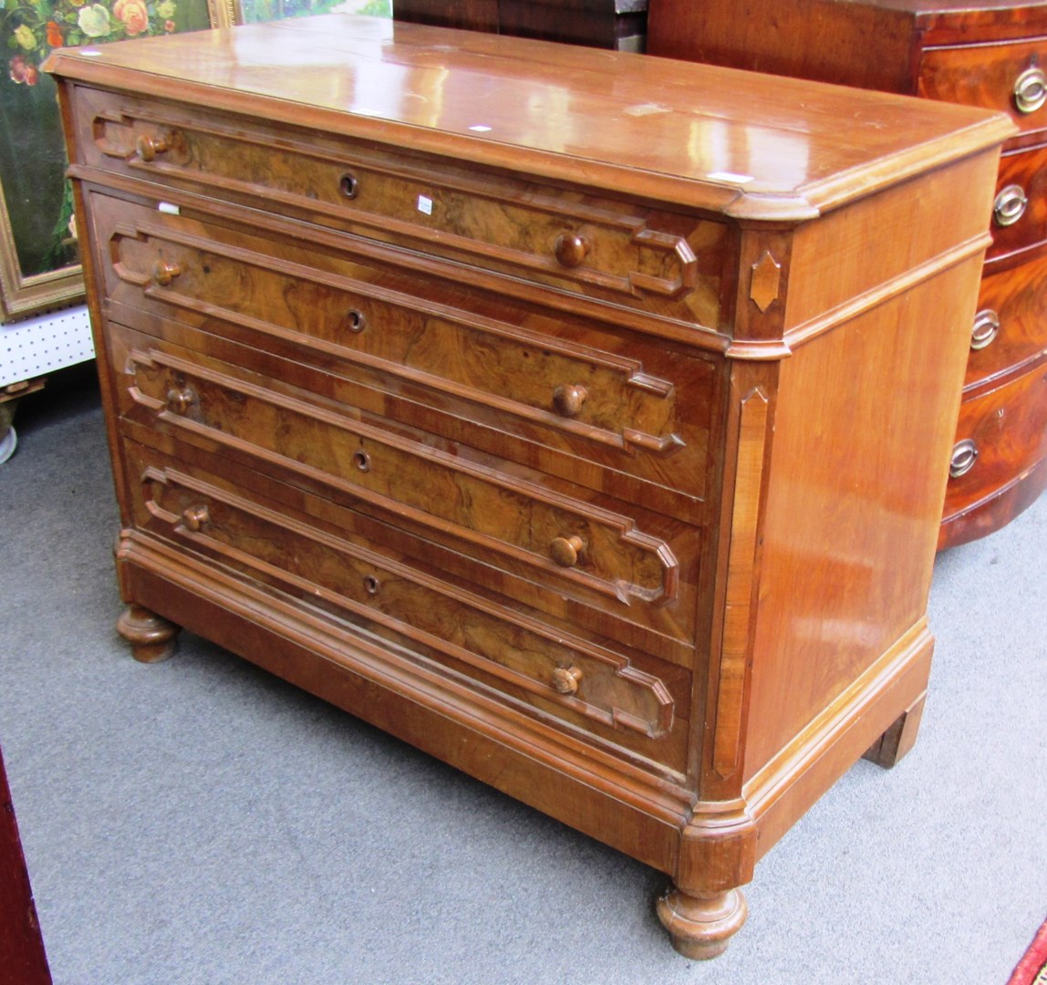 Appraisal: A th century Continental walnut four drawer commode with geometric