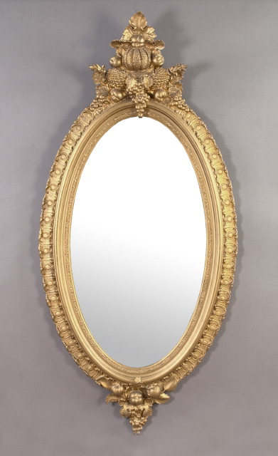 Appraisal: Tall American Carved Giltwood and Plaster Oval Looking Glass third