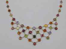 Appraisal: A multi gem necklace set in yellow metal tests ct